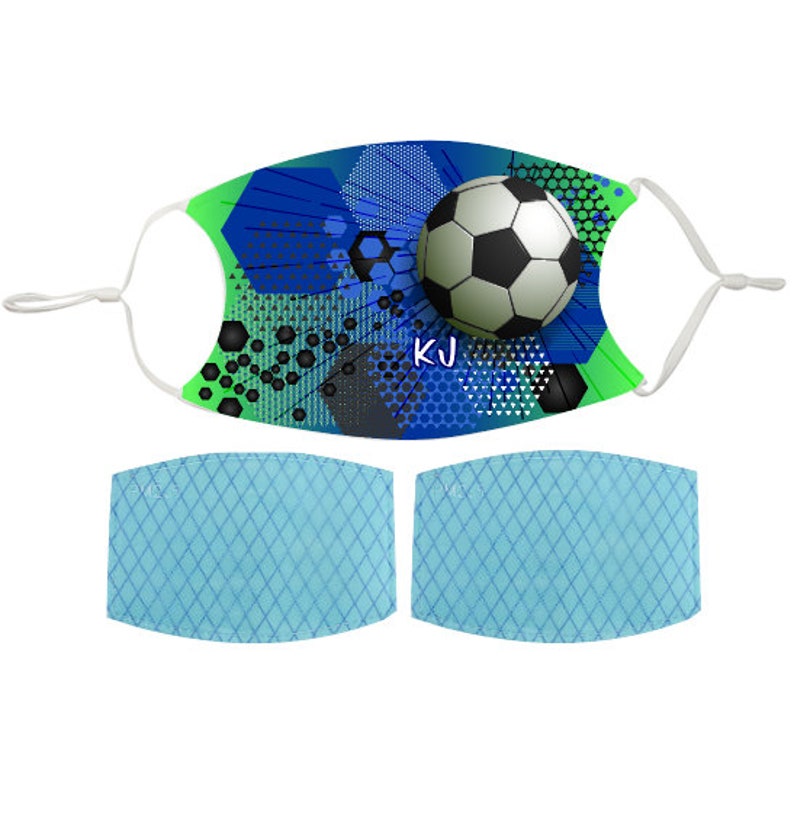 May include: A blue, green, and black face mask with a soccer ball graphic and the initials "KJ". The mask comes with two blue filter inserts.