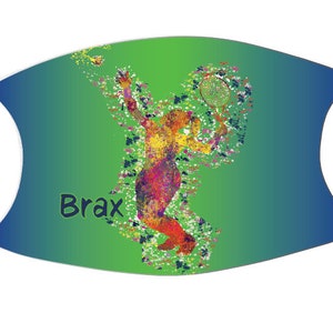 May include: A green and blue gradient face mask with a colorful silhouette of a tennis player and the name "Brax" printed on the front.