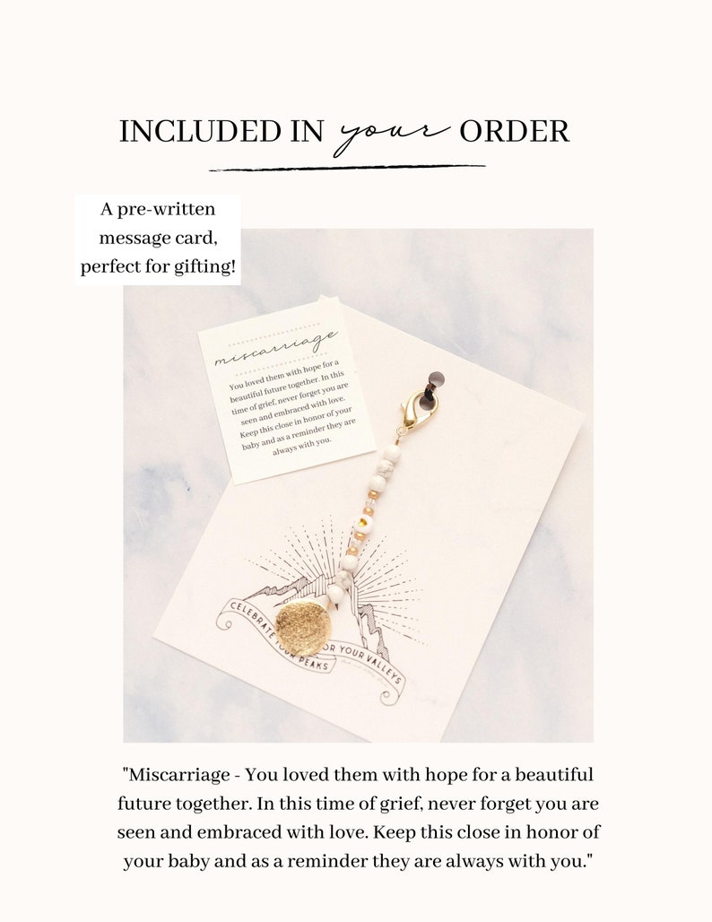 May include: A pre-written message card with the text "Miscarriage - You loved them with hope for a beautiful future together." A gold-colored charm with a mountain design is attached to a beaded chain.