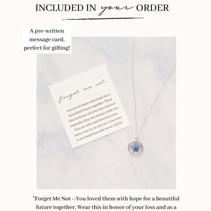 May include: A silver necklace with a round pendant containing blue flowers, displayed with a message card. The card reads "Forget Me Not" and includes a heartfelt message about remembrance and love.