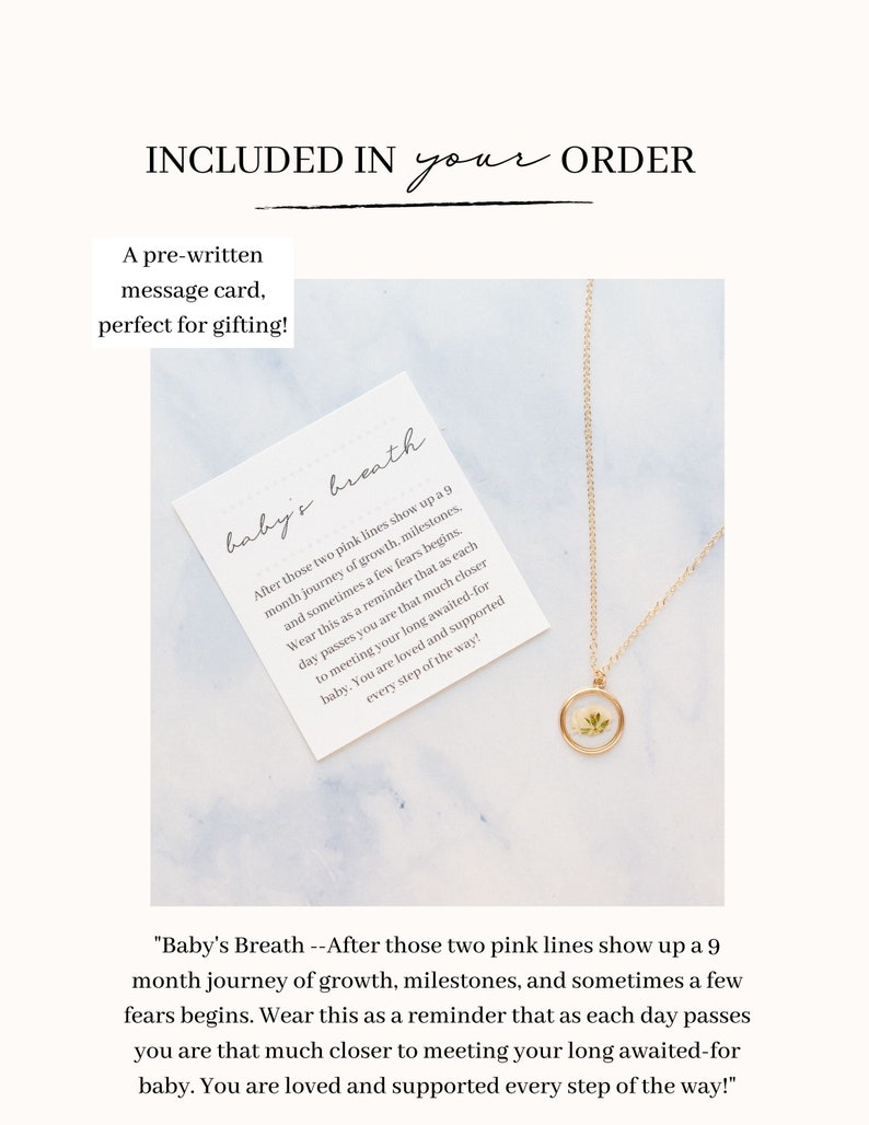 May include: A gold-toned necklace with a circular pendant containing a small white flower, accompanied by a square white card featuring the text: Baby's Breath --After those two pink lines show up a 9 month journey of growth, milestones, and sometimes a few fears begins.