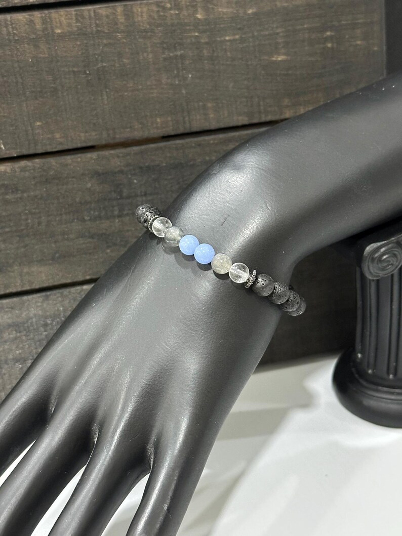 Lava Stone, Clear Quartz, Black Labradorite and Blue Aragonite glows in