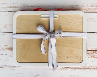 May include: A white wooden serving tray with a white ribbon tied around it. The tray is personalized with the name "Henry" and a shark graphic.