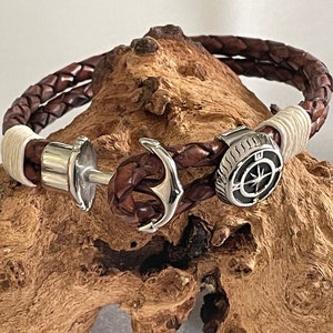 Braided leather bracelet with anchor clasp and compass embellishment