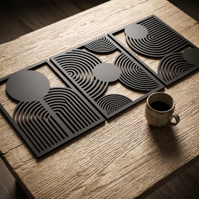 May include: Three rectangular black wall art panels featuring intricate laser-cut geometric patterns of concentric semicircles and solid circles. The panels are arranged in a row, showcasing a repeating linear design with a matte finish.