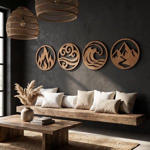 May include: Four circular wooden wall art pieces featuring cut-out designs representing fire, air, water, and mountains. Each piece is mounted on a dark gray wall above a long wooden bench with several beige throw pillows arranged in a row.