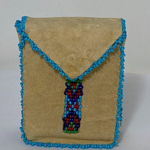 May include: A small, tan leather pouch with a beaded flap closure. The pouch is decorated with a beaded design in shades of blue, red, and green.