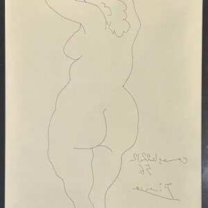 May include: A black line drawing on a cream-colored background depicting a standing figure with arms raised behind the head. The artwork features a signature and date in the lower right corner, all enclosed within a simple black frame.