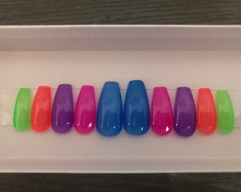 Press-on Jelly translucent color nails. Available in rainbow or same color. Ballerina shape available in various sizes and lengths.