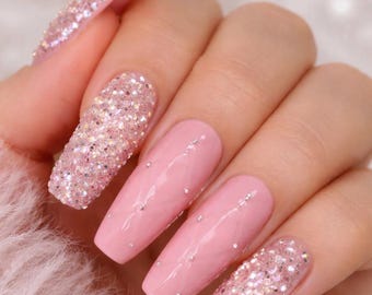 Pink quilted, with crystals press on nails.
