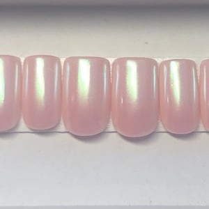 Pastel pink chrome press on nails.