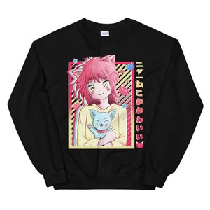 May include: Black sweatshirt with a graphic of a pink-haired anime girl holding a blue cat. The text "ニャんこがかわいい" is printed on the right side of the graphic.
