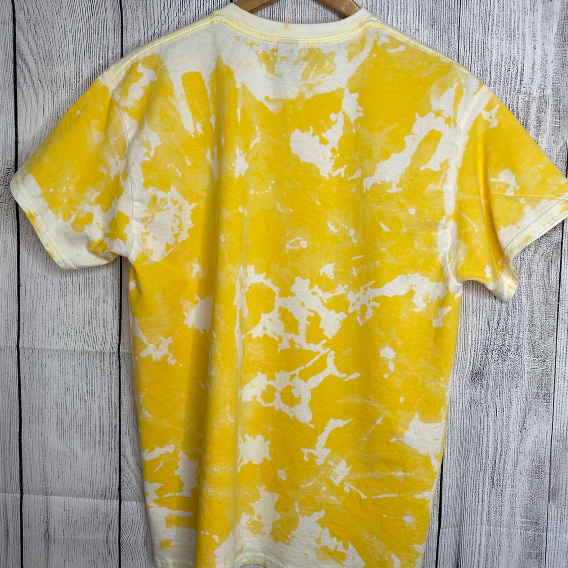 reverse tie dye yellow shirt
