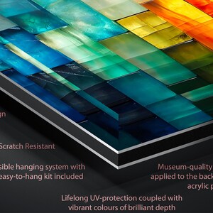 May include: Abstract artwork with a unique design, featuring a mosaic of colourful rectangular shapes in shades of blue, green, yellow, and orange. The artwork is shatter and scratch-resistant, with an invisible hanging system. The text says "Eye-catching".
