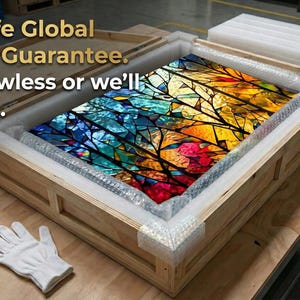May include: A colorful stained-glass artwork, depicting a vibrant abstract design, is securely packaged in a wooden crate with protective foam. The artwork features a spectrum of colors, including blue, yellow, and red. The text on the image says "100% Safe Global Delivery Guarantee."