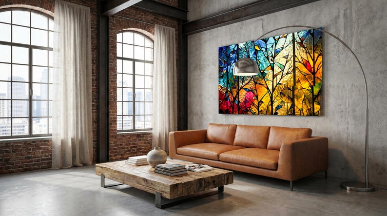 May include: A modern living room with a brown leather sofa, a wooden coffee table, and a colorful abstract art piece. Large windows with sheer curtains provide natural light. A silver arc lamp illuminates the space.
