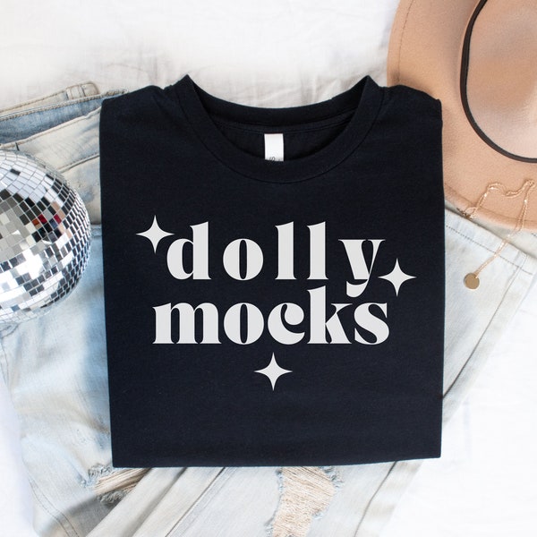 Bella Canvas 3001 Black T Shirt Mockup | Black Shirt Mockup | Folded Shirt with disco ball and jeans | DollyMocks