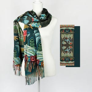 May include: A dark green scarf with a colorful dragon and wave pattern. The scarf has fringed edges and is made of a soft, luxurious fabric.