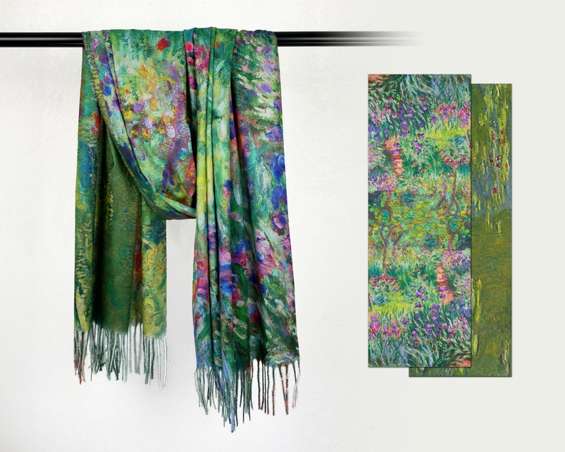 May include: A green scarf with a colorful floral design, hanging from a black rod. The scarf has a fringe at the bottom. Two additional panels with the same floral pattern are displayed to the right. The design features shades of green, blue, purple, and red.