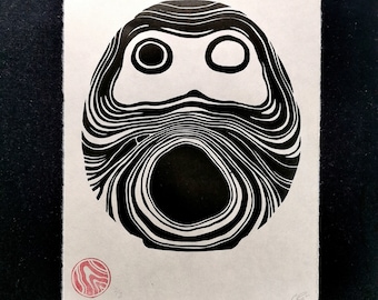 Floating Luck Daruma. Linocut printed by hand