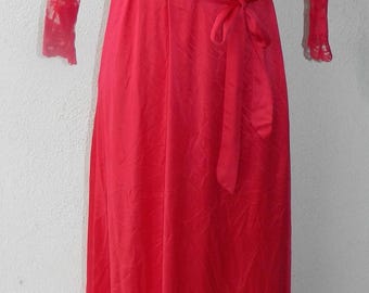May include: A vibrant red, floor-length robe with a wrap-around design and a matching belt. The sleeves are three-quarter length and feature delicate lace detailing. A classic piece of sleepwear.