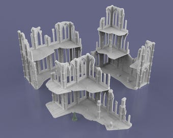May include: A set of gray miniature gothic ruins, ideal for tabletop gaming. The structures feature arched windows, detailed stonework, and multiple levels. A small green figure is included for scale.