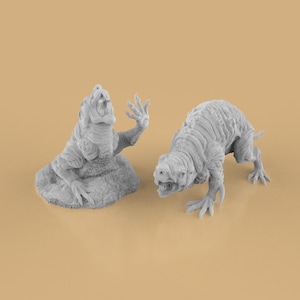 May include: Two gray, detailed monster figurines. One is seated, with an open mouth and raised hand. The other is a quadruped, with a textured body and open mouth. Both have clawed hands and feet, and are on a tan background.