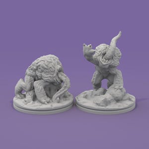 May include: Two gray fantasy creature figurines. One is a crouching monster with tentacles, the other is a horned humanoid figure with an open mouth and raised arm. Both are on round bases, set against a purple background.