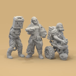 May include: Three gray miniature figurines depicting post-apocalyptic characters. One figure wears a box on their head, another holds a cylindrical object, and the third rides a small vehicle with a large tire. The figures are detailed and appear to be part of a tabletop game.