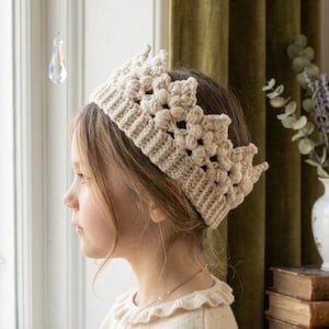 May include: A set of three ceramic mugs with a speckled, matte finish. The mugs are in shades of cream, light gray, and dark gray. Each mug has a simple, minimalist design and a rounded handle. Perfect for coffee or tea.