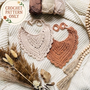 May include: Two handmade crochet bibs in beige and rust colors, with a scalloped edge design. The image also shows yarn skeins, dried flowers, and the text "CROCHET PATTERN ONLY" in a circular design.