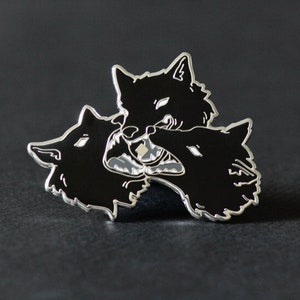 Thrown to the Wolves enamel pin