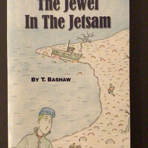 May include: A book cover for "The Jewel in the Jetsam" by T. Bashaw. The cover art features a cartoon illustration of a beached boat, a running figure, and a man holding a small object. The title is in large, bold letters.