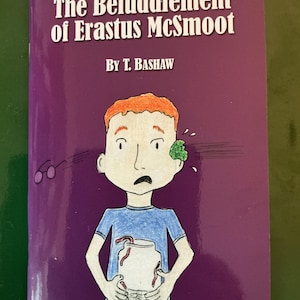 May include: A book cover with the title "The Befuddlement of Erastus McSmoot" by T. Bashaw. The cover features an illustration of a cartoon boy with orange hair, a blue shirt, and a jar of worms. The background is a deep purple.