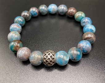 Unisex handmade stretech bracelet in teal-hued blue 10mm apatite beads accented with sterling silver