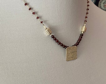 Garnet beaded necklace with sterling silver pendant