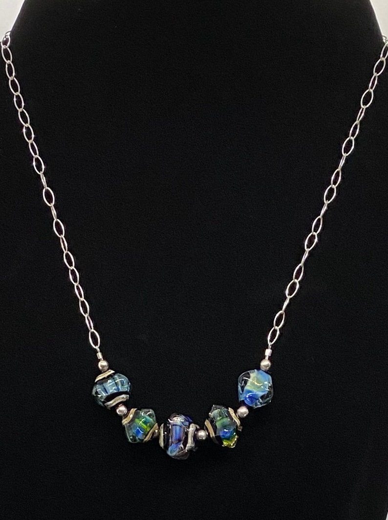 Handmade glass and sterling silver necklace with changeable colors of sky blue and emerald green