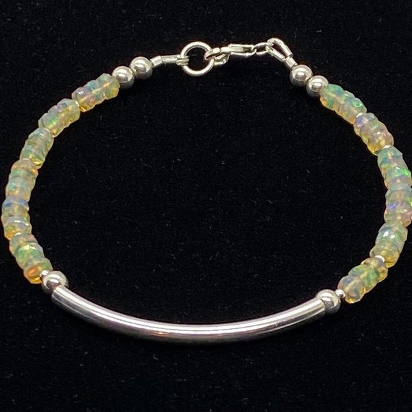 7 3/4 inch bracelet of sparkly, fiery Ethiopian opal and sterling silver in this elegant handmade bracelet.  Opal is October birthstone.