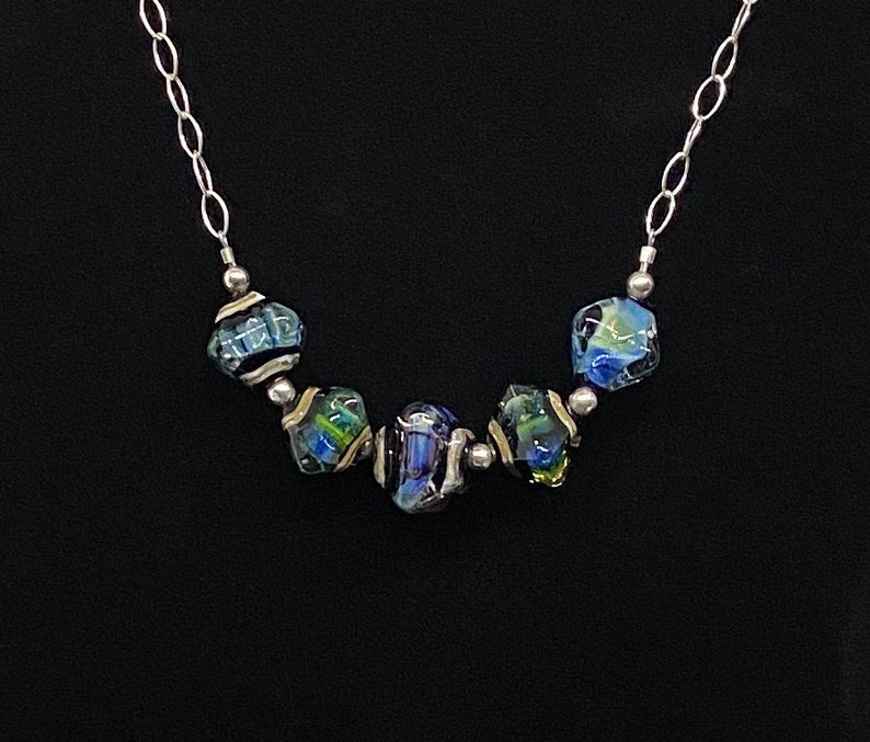 Handmade glass and sterling silver necklace with changeable colors of sky blue and emerald green