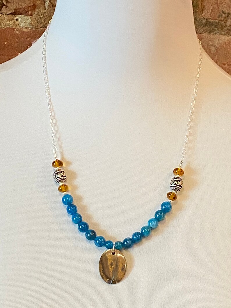 /& sterling silver beads. glass A bright line of iridescence shines in this natural Australian boulder opal accented with beautiful apatite