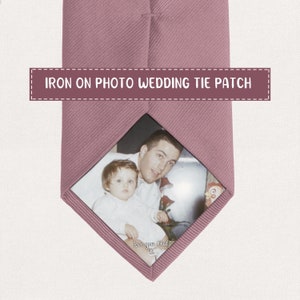 May include: A dusty rose tie with an iron-on photo patch. The patch features a photograph of a man and a child, with the text "Love you Dad" at the bottom. The text "IRON ON PHOTO WEDDING TIE PATCH" is displayed across the top.