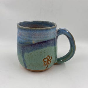 Purple landscape mug with carved flower