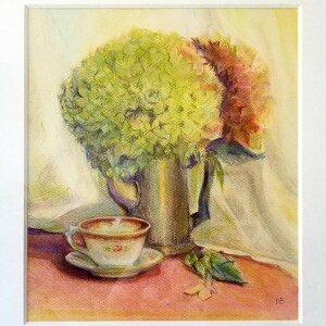 May include: A pastel painting of a still life featuring a silver pitcher filled with green and pink hydrangeas. A teacup and saucer with floral designs sit on a red surface. The artwork is framed in white.