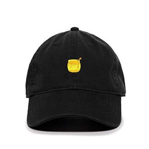 May include: A black baseball cap with an embroidered yellow honey pot and a honey dipper on the front.