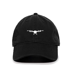 May include: A black baseball cap with a white embroidered drone silhouette.