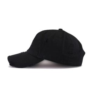 May include: A black distressed baseball cap with a slightly curved brim. The cap has a worn look with small holes and frayed edges.