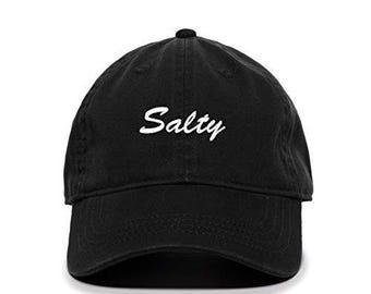 May include: A black baseball cap with the word "Salty" embroidered in white on the front.