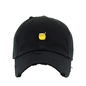 May include: Black distressed baseball cap with a small embroidered yellow honey pot design.