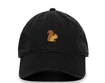 May include: A black cotton baseball cap with an embroidered brown and yellow squirrel on the front.