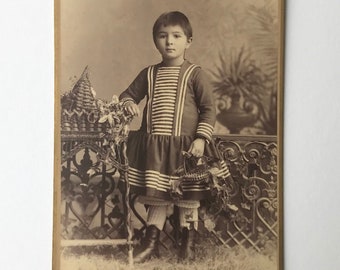 Girl at the garden fence, antique photograph from Switzerland by Peter Does, between 1886 and 1889